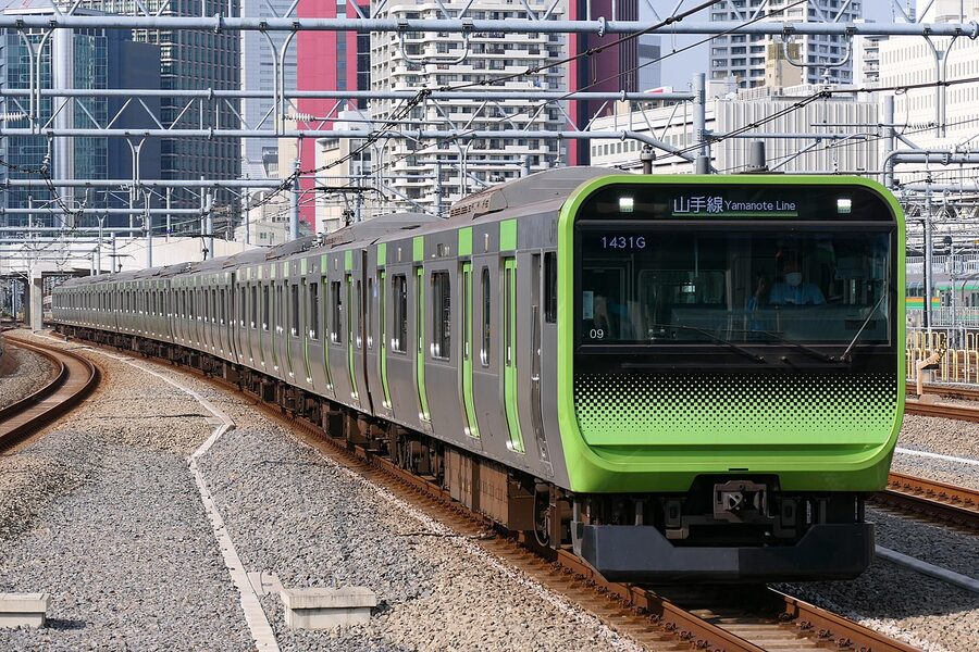 JR East E235 series 0 train approaching Takanawa Gateway Station on the Yamanote Line