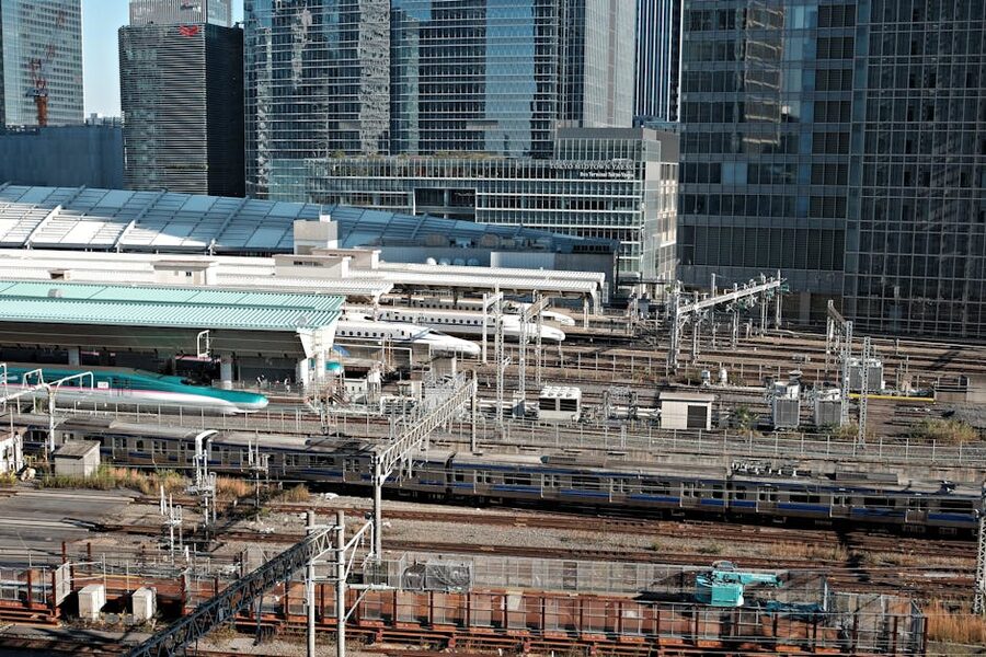 Tokyo Station with Shinkansen and skyscrapers