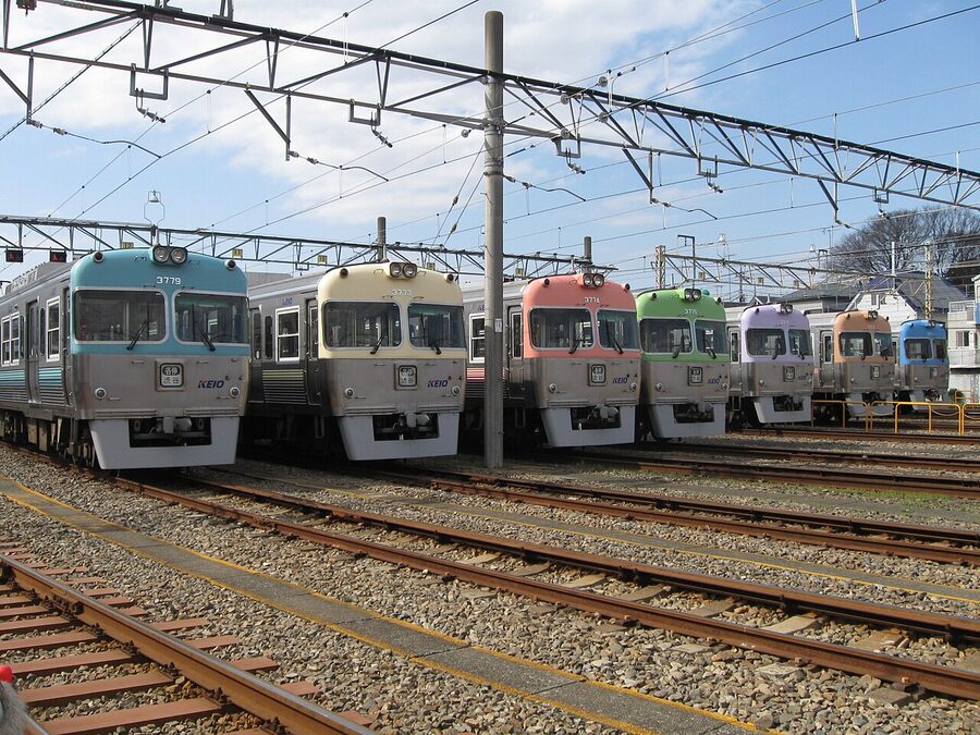 Seven Keio 3000 series sets in their seven pastel front-end colours, lined up at depot