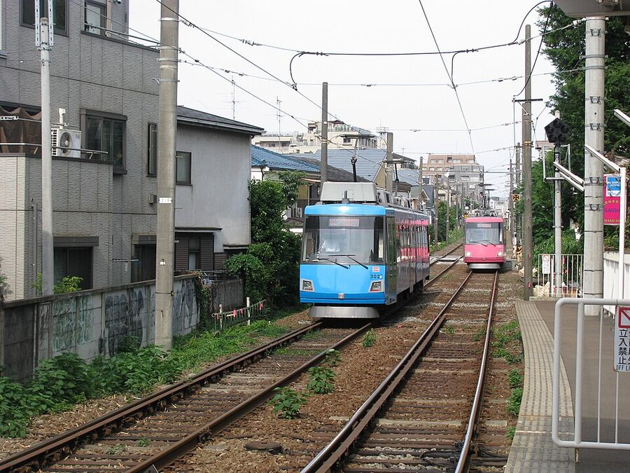 Tokyu Setagaya Line tram running on its private right-of-way through residential west Tokyo