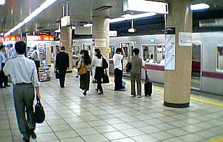 Departure boards at Shibuya Station for the Tokyu Den-en-toshi Line