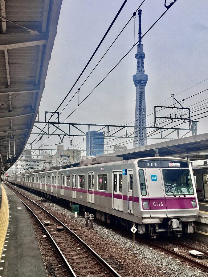 An 8000 series Hanzomon Line train passing the Tokyo Skytree