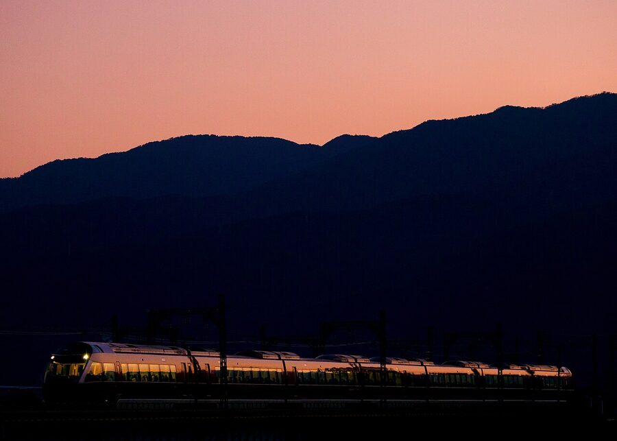 Odakyu 70000 GSE crossing the Sakawa River bridge at sunset