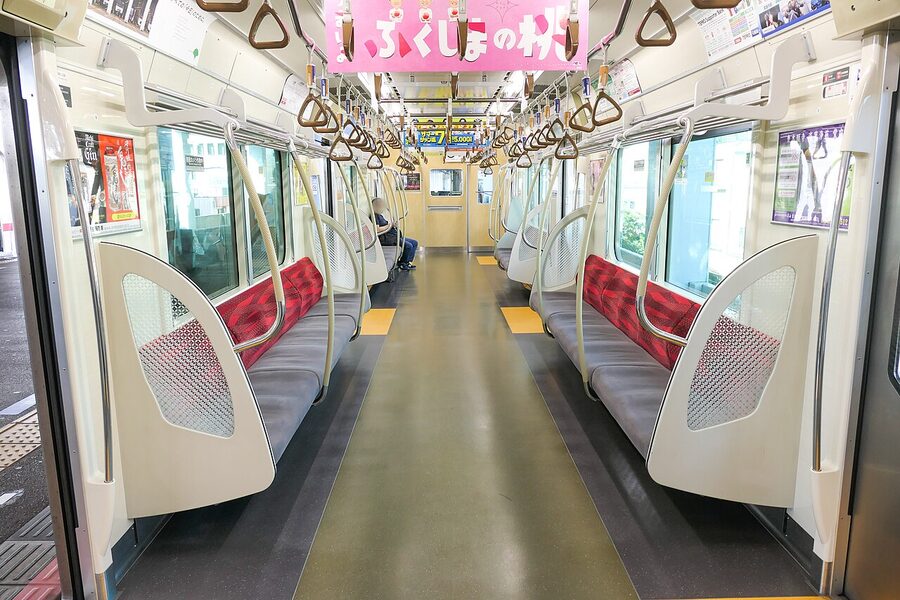 Toei 5500 series interior with washi-pattern panels and gold accents