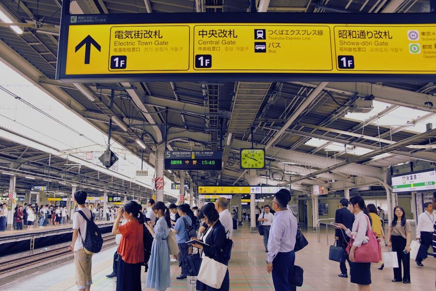 Tokyo subway platform with commuters waiting
